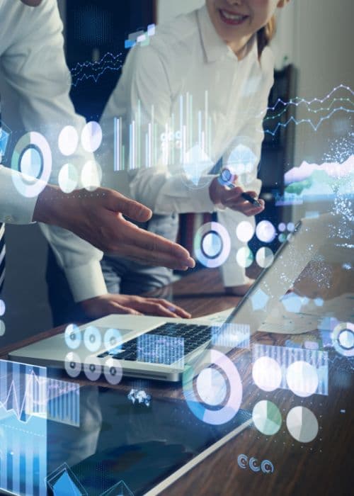 Business professionals reviewing R&D funding data on laptop